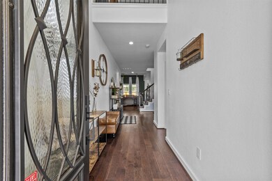 Entryway with stairs, hardwood / wood-style floor