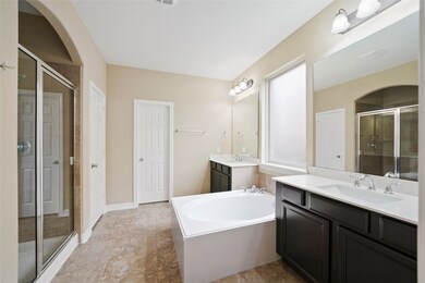 The en suite Master Bathroom (11x16) includes an over-sized shower, separate tub & double vanities and is the highlight of the Master suite.  The closet door in the distance, opens up to a spacious closet.  Such a great space to get ready for your busy day!
