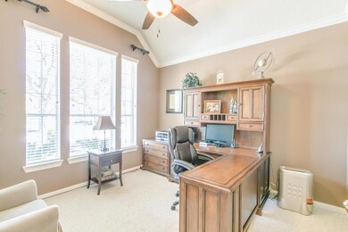 Beautiful study/library with high ceilings and tons of natural light.