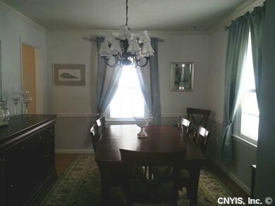 Dining Room. The formal dining room features a bea