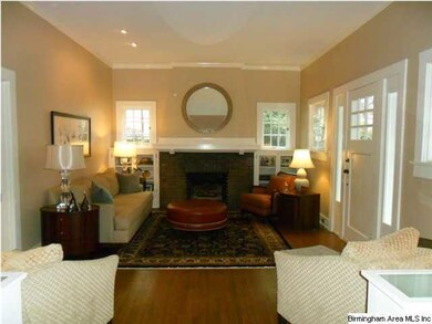 Large formal living room with glass front bookcase