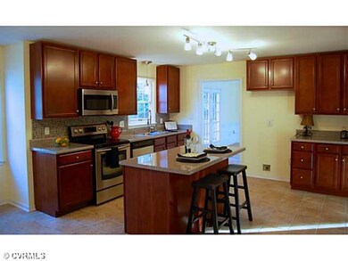 Kitchen - Kitchen features cherry cabinets, tile f