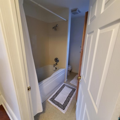 Bathroom with toilet and tub / shower combination