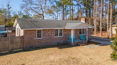 Single story home with a front yard