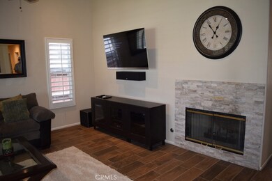 Attractive custom fireplace.  Wall will accommodate large flat screen TV.
