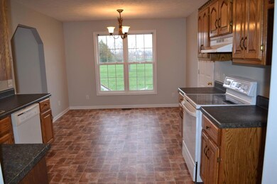 View of the kitchen from the dining room.  Large breakfast area with a view of the backyard.  