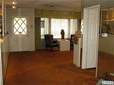 Very large living room. Hardwood under carpet