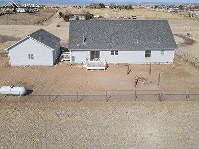 Here is the backyard fenced area complete with fir