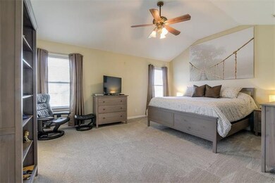 Spacious master suite with vaulted ceilings and pr
