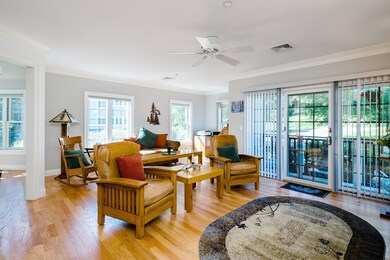 Lot of windows and shiny hardwood flooring abound.