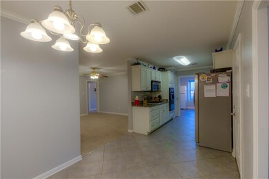 Kitchen with Den to the left in pic