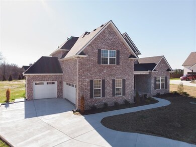 All Brick & Stone home features a 3 Car Garage 