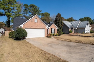 Side view with mature landscaping.