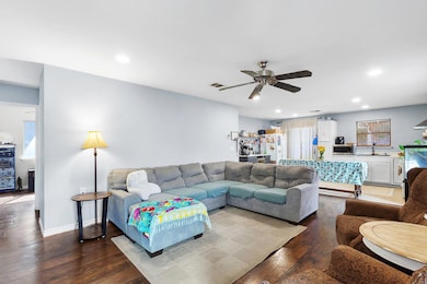 Living area featuring hardwood / wood-style floors, recessed lighting, and ceiling fan
