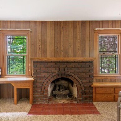 Fireplace with built in shelves and a desk