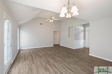 The great room is open to the dining room featurin