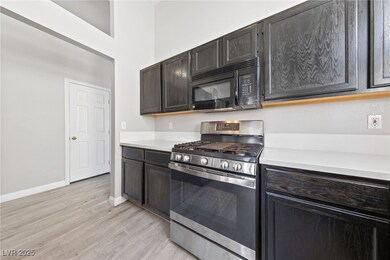 Kitchen with stainless steel range with gas cookto