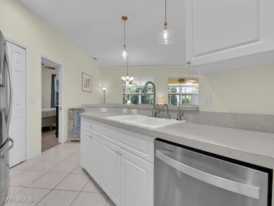 Kitchen with stainless steel dishwasher, a sink, l