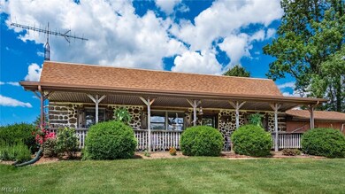 View of front of property featuring a front yard and covered porch