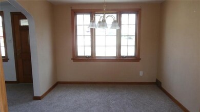 Light and bright dining room with chandelier, new 