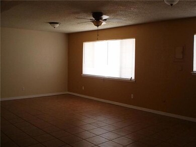 Living area w/ new fixtures, ceiling fan