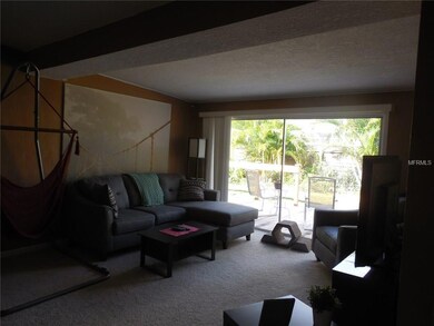 Living room with large slider to back deck area. Very open feel.