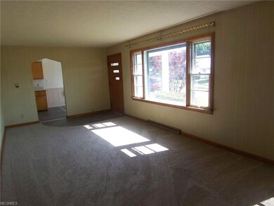 The living room is spacious and offers lots of nat