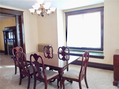 Large dining room with great window seat  and plen