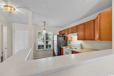 Kitchen featuring white electric range oven, hangi