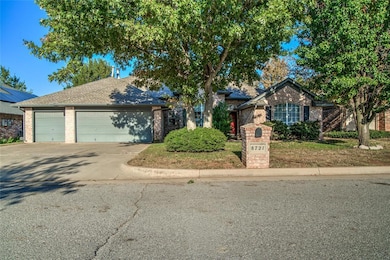 View of front facade with brick siding, concrete driveway, an attached garage, and a shingled roof
