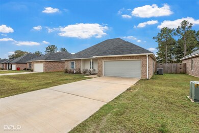 View of front of house featuring a garage, roof with shingles, concrete driveway, and brick siding