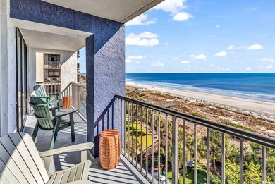 Balcony featuring a water view and a beach view