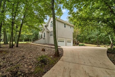 Long concrete driveway overlooking the neighbor's 