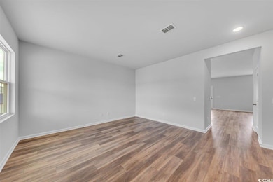 Unfurnished room featuring baseboards, recessed li
