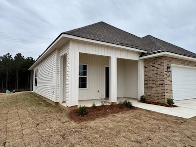 View of front facade featuring a garage, roof with