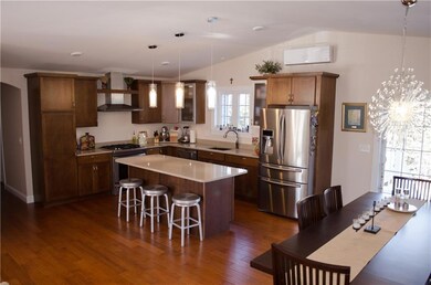 View from living room to kitchen and...