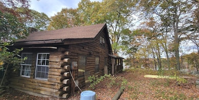 Side of house, side porch with Oxoboxo Lake in the background