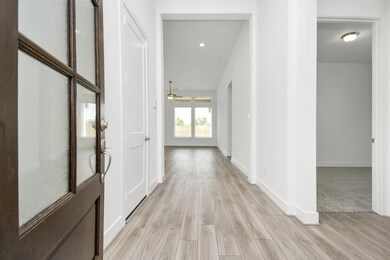 This is a bright, spacious entryway with modern wo