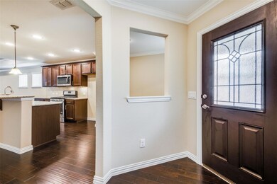Entrance foyer featuring dark wood-type flooring, 
