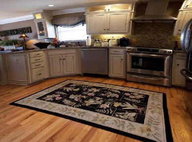 Open kitchen with custom cabinets to the ceiling, Stainless Steel Appliances.  All ready for the holiday gatherings!!