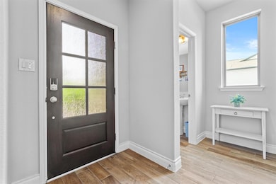 Entryway featuring light wood finished floors and