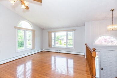 Entry into living room with vaulted ceilings