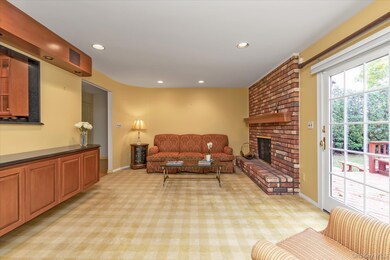 Family Room featuring recessed lighting, & a fireplace