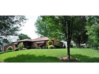 Exterior Front. Manicured grounds with underground