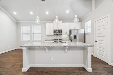 Beautiful pendant lighting illuminate the large ki