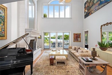 Two story living room with fireplace.