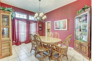 Formal Dining. Large transom style windows and eas