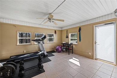 Exercise room featuring tile patterned floors and 