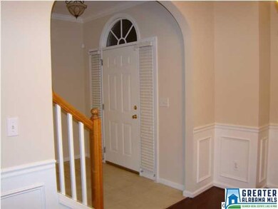 Front entrance has tiled flooring pretty staircase