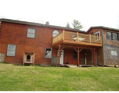 Exterior Back. Back of house with...